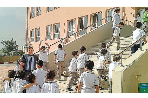 Sabri Şaran, president of the Kardelen Educational Institutions, joins students during recess. (Photo: Today's Zaman)