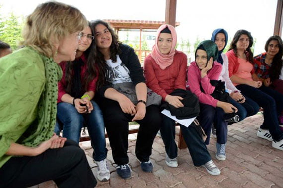 Mara Dodge, history professor at Westfield State University in Westfield, Mass., talks to a group of eighth grade students at Mehmet Ozdemir Primary School in Konya, Turkey about their hobbies and aspirations on Thursday, June 7, 2012. The ten-day TCCA Turkey trip included visits to schools and other organizations founded by followers of Turkish imam Fethullah Gulen. (Yi-Ke Peng / Times Union)