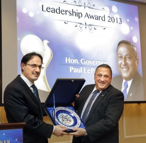 Eyup Sener, left, president of the Turkish Cultural Center Maine, presents Gov. Paul LePage with a traditional Turkish plate after LePage was honored with a leadership award at an annual Friendship Dinner held by the Turkish Cultural Center at the Sable Oaks Marriott in South Portland Tuesday. Gabe Souza/Staff Photographer