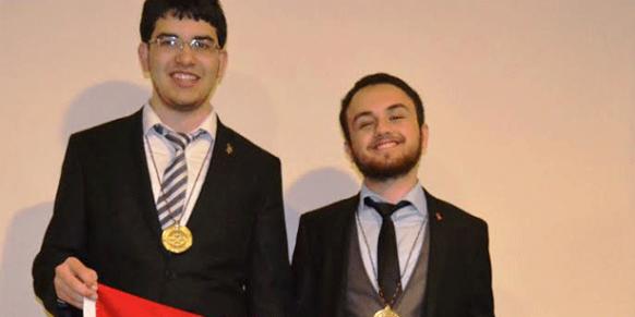 Osman Akar and Emre Girgin, who won a gold medal and a silver medal respectively at the 55th International Mathematical Olympiad (IMO), pose together in this July 13 photo. (Photo: Cihan)