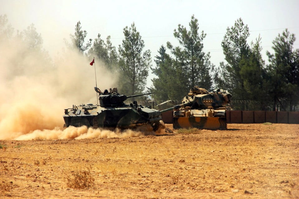 A Turkish army tank and an armoured vehicle are stationed near the Turkish-Syrian border in Karkamis in the southeastern Gaziantep province, Turkey, August 23, 2016. Picture taken August 23, 2016. Ihlas News Agency via REUTERS ATTENTION EDITORS - THIS PICTURE WAS PROVIDED BY A THIRD PARTY. FOR EDITORIAL USE ONLY. NO RESALES. NO ARCHIVE. TURKEY OUT. NO COMMERCIAL OR EDITORIAL SALES IN TURKEY.     TPX IMAGES OF THE DAY      - RTX2MSUX