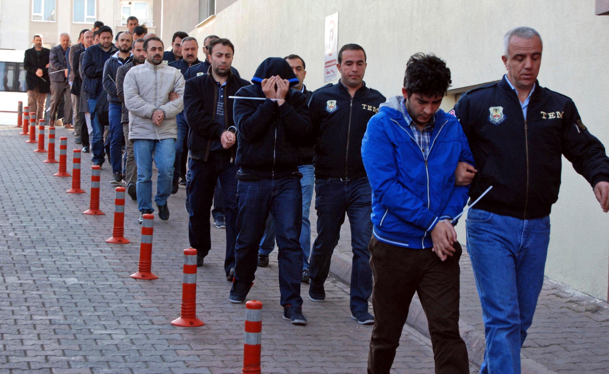 Police officers escort people arrested because of suspected links to US-based cleric Fethullah Gulen, in Kayseri, Turkey on April 26, 2017. (File photo: AP)